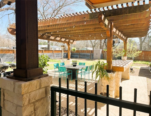 401 San Jacinto St, Smithville, TX 78957 - view of patio with a fenced backyard, a storage shed, an outdoor structure, and a pergola