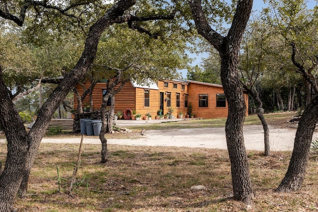 view of front of house featuring log veneer siding