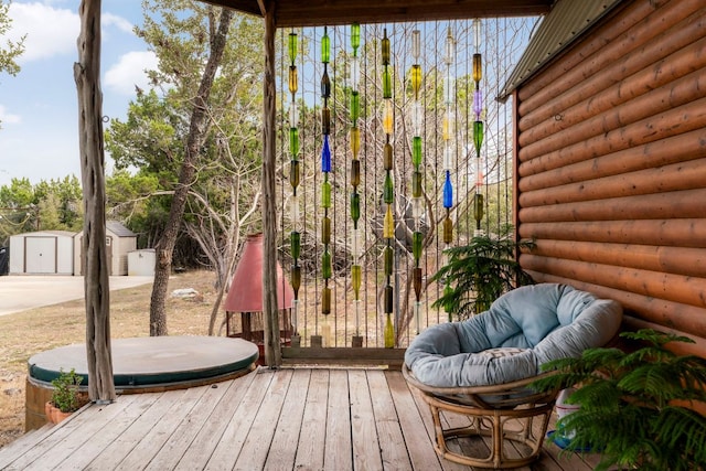 wooden terrace with an outdoor structure