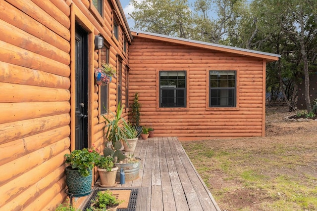 property entrance with log veneer siding