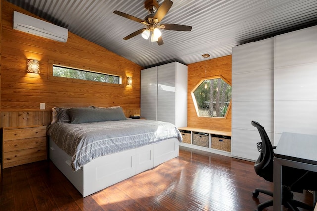 bedroom with a wall unit AC, wooden ceiling, hardwood / wood-style flooring, lofted ceiling, and wood walls