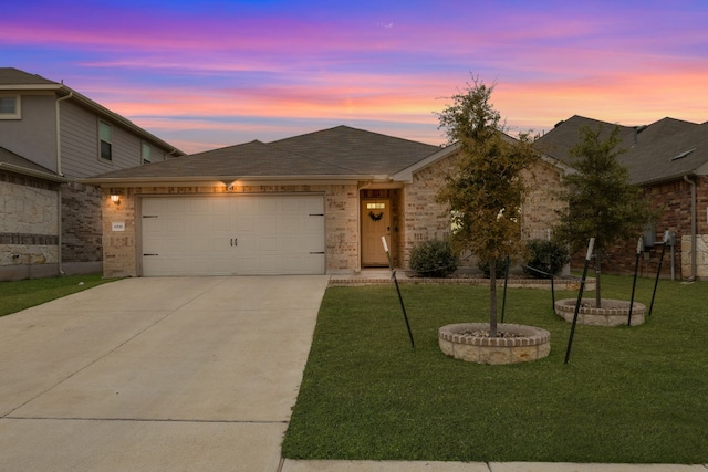 single story home with a garage, driveway, brick siding, and a front yard