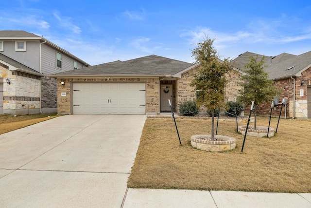 ranch-style home featuring driveway, roof with shingles, and an attached garage