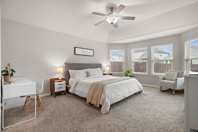 carpeted bedroom with ceiling fan and baseboards