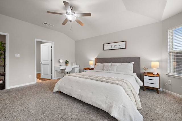 carpeted bedroom featuring lofted ceiling, ceiling fan, visible vents, and baseboards