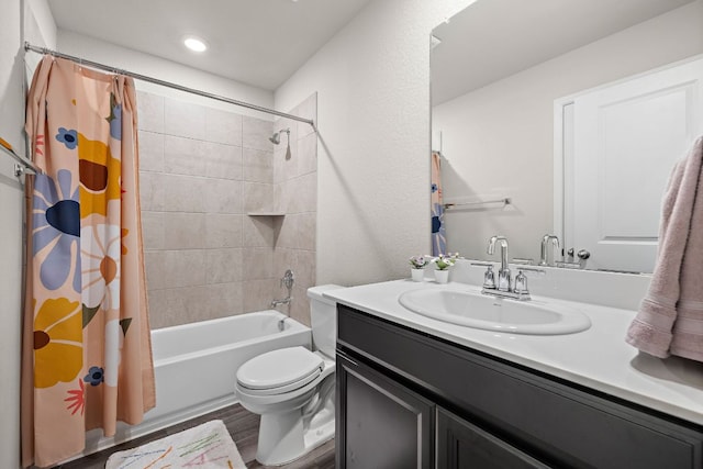 bathroom featuring wood finished floors, vanity, toilet, and shower / tub combo with curtain