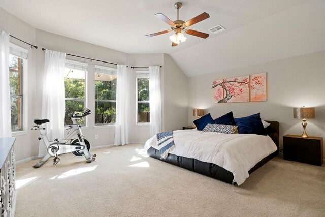 carpeted bedroom with lofted ceiling, visible vents, ceiling fan, and baseboards