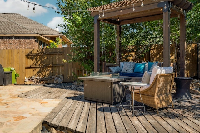 wooden deck with a fenced backyard, an outdoor hangout area, and a pergola