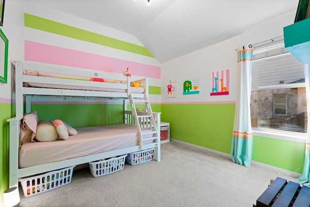 bedroom featuring carpet, vaulted ceiling, and baseboards