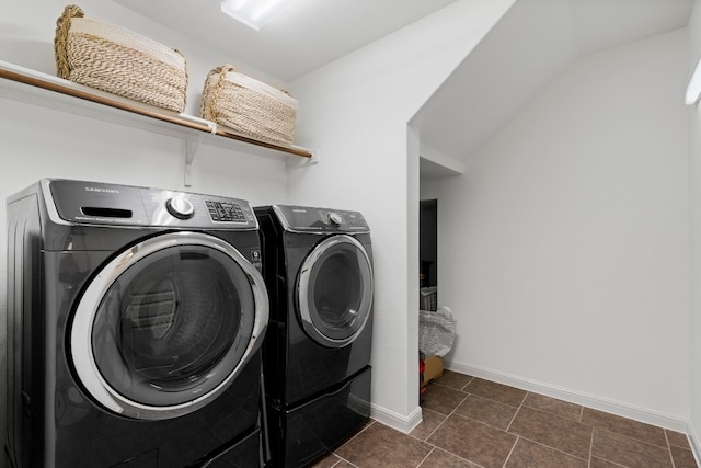 laundry area featuring laundry area, washer and clothes dryer, and baseboards