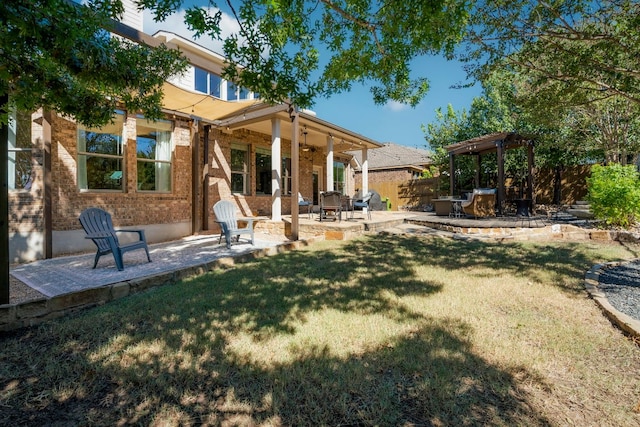 view of yard with fence and a patio