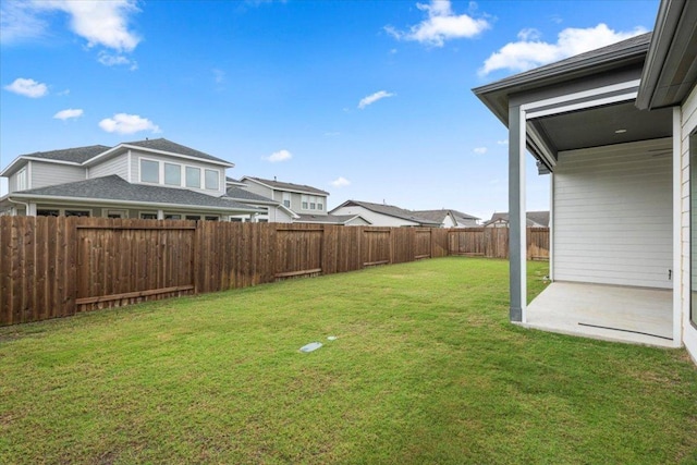 view of yard with a patio area and a fenced backyard