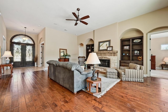 114 Hazelnut Ct, Driftwood, TX 78619 - living room featuring wood-type flooring, french doors, and ceiling fan