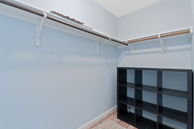 walk in closet featuring light wood-style flooring