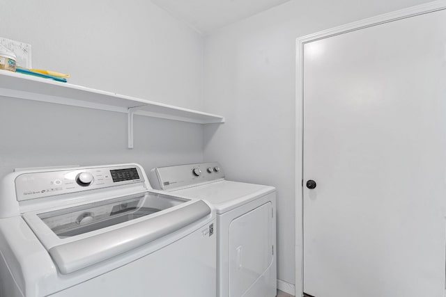 clothes washing area with laundry area and washing machine and clothes dryer