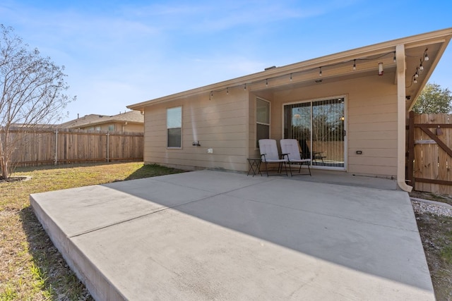 back of property featuring a patio and a fenced backyard