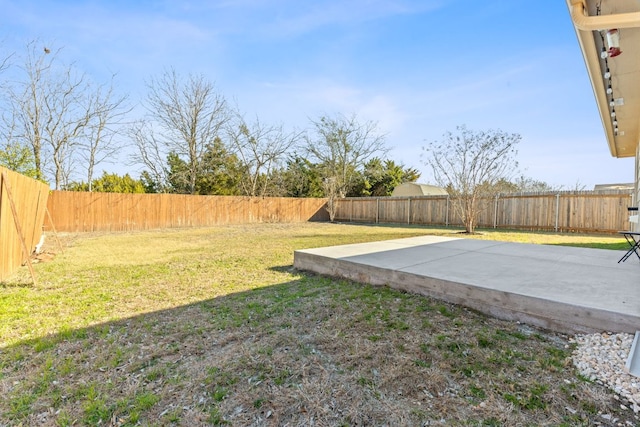 view of yard with a fenced backyard and a patio