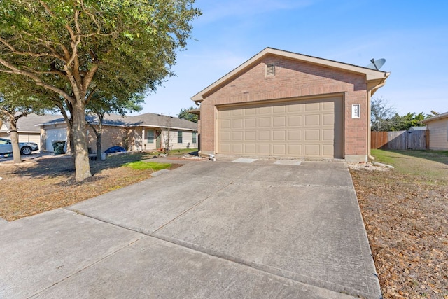 single story home featuring a garage, fence, and brick siding