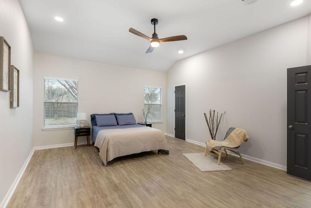 bedroom featuring recessed lighting, baseboards, vaulted ceiling, and light wood finished floors