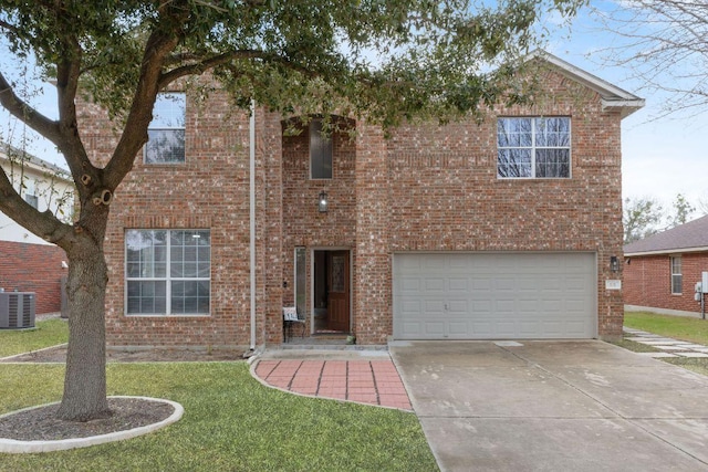 traditional-style home with a garage, driveway, brick siding, and central AC