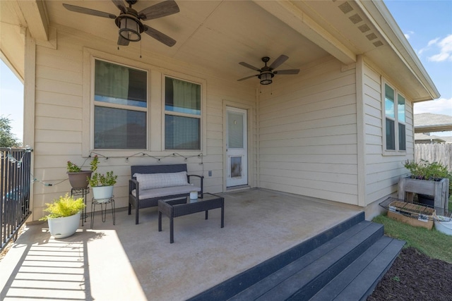 view of patio / terrace featuring fence and ceiling fan