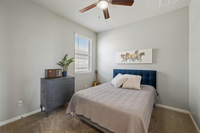 carpeted bedroom featuring visible vents, a ceiling fan, and baseboards