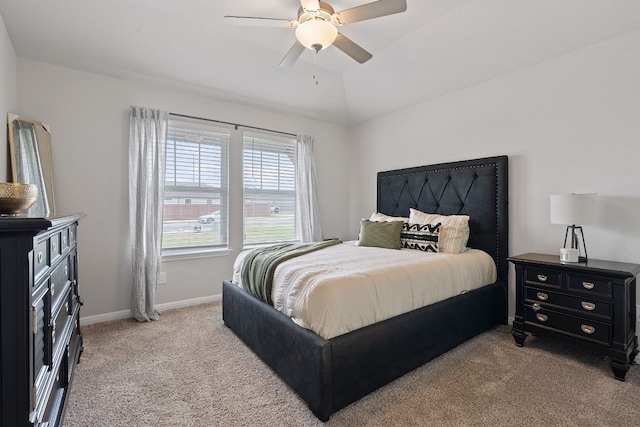 bedroom with ceiling fan, carpet flooring, and baseboards