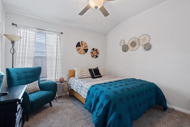 bedroom with a ceiling fan, carpet, vaulted ceiling, and baseboards