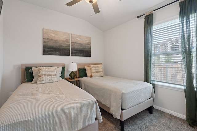 carpeted bedroom featuring lofted ceiling, multiple windows, baseboards, and a ceiling fan