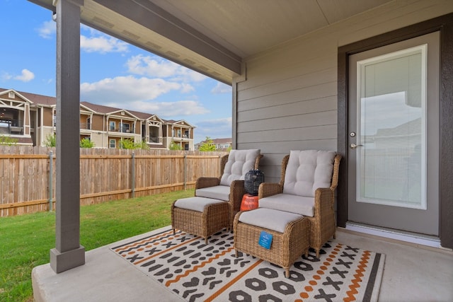 view of patio with a residential view and fence