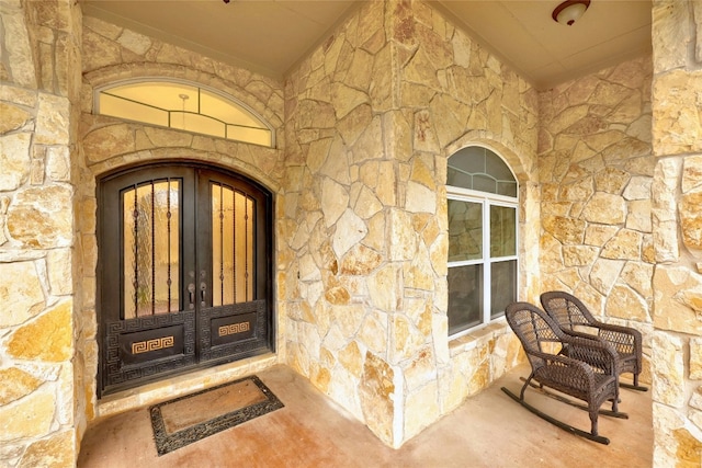 entrance to property with stone siding