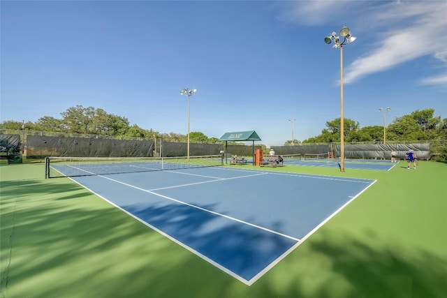 view of sport court with fence