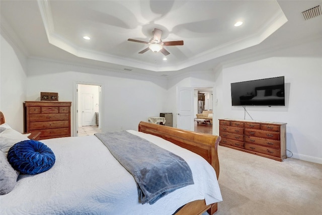 carpeted bedroom with ornamental molding, recessed lighting, a raised ceiling, and visible vents