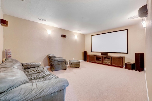 cinema room with carpet and visible vents