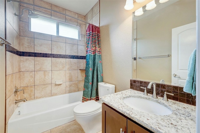 bathroom with shower / tub combo with curtain, vanity, and toilet