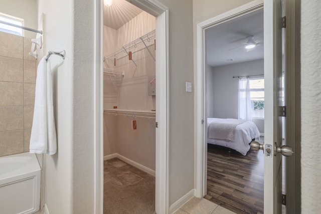 2000 Amur Dr, Austin, TX 78745 - bathroom featuring a bath, a walk in closet, and connected bathroom