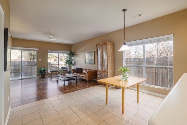 2000 Amur Dr, Austin, TX 78745 - dining room with light tile patterned floors and baseboards
