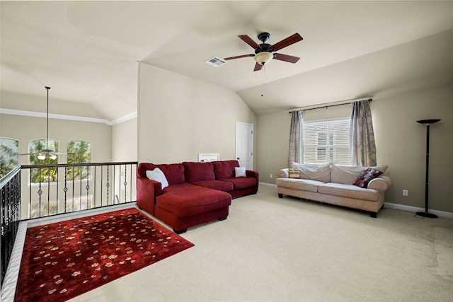 living room featuring vaulted ceiling, carpet floors, and visible vents