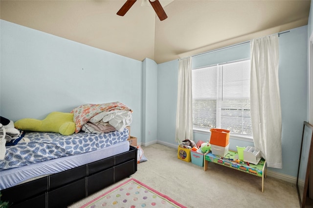 bedroom with carpet, vaulted ceiling, ceiling fan, and baseboards