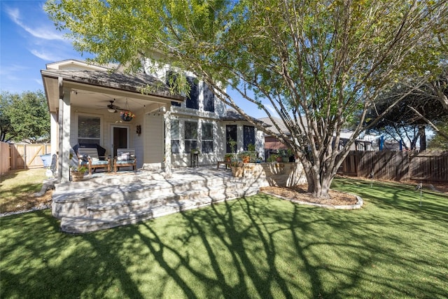 back of house with ceiling fan, a patio, a lawn, and a fenced backyard