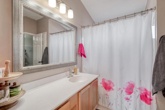 full bath featuring a shower with shower curtain and vanity