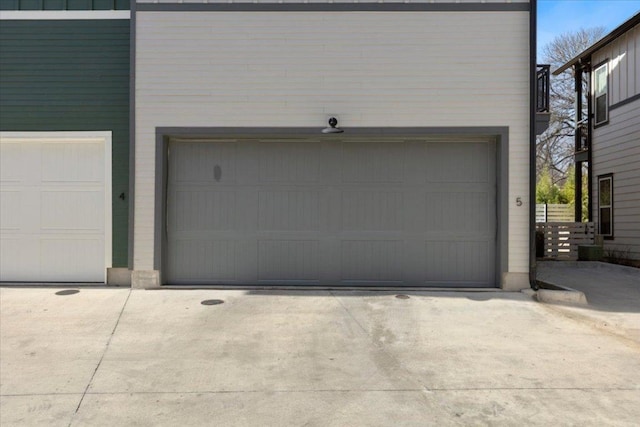 garage with concrete driveway