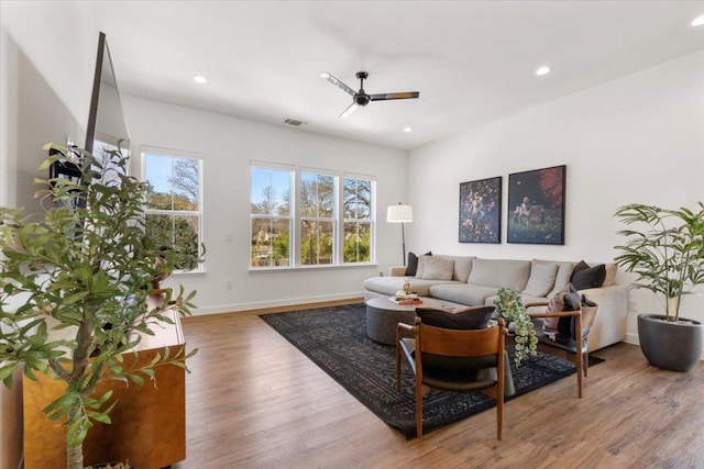 living area featuring recessed lighting, visible vents, ceiling fan, wood finished floors, and baseboards