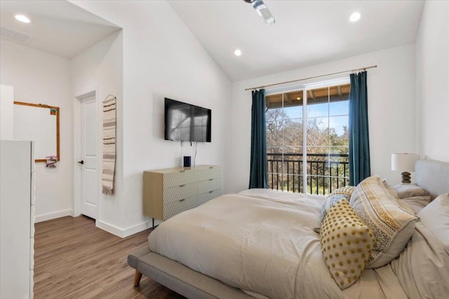 bedroom with recessed lighting, wood finished floors, visible vents, baseboards, and vaulted ceiling