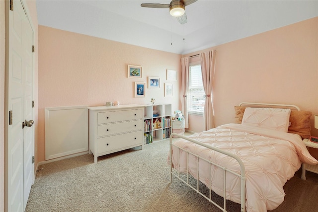 bedroom featuring light carpet and ceiling fan