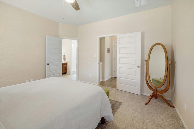 bedroom with baseboards, visible vents, a ceiling fan, and light colored carpet