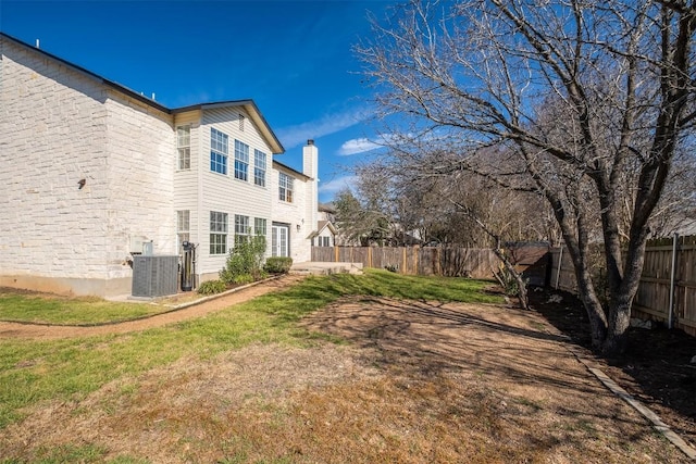 view of yard featuring a fenced backyard and cooling unit