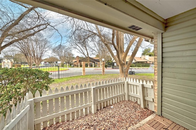 view of patio featuring a residential view, visible vents, and fence