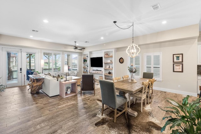 dining space featuring recessed lighting, visible vents, baseboards, and wood finished floors