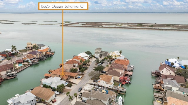 birds eye view of property with a residential view and a water view